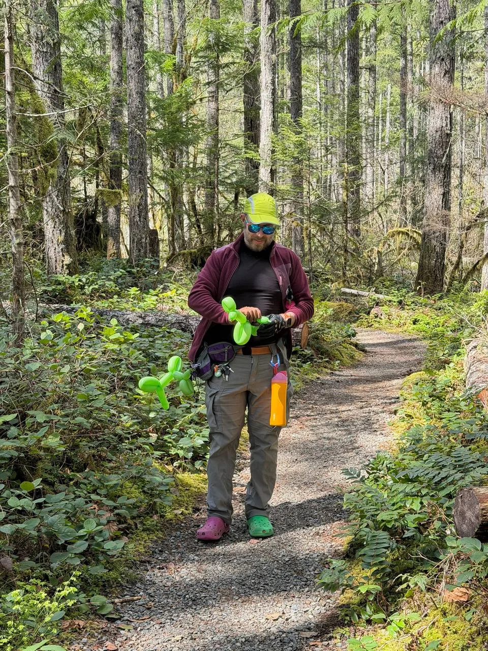 Igor on a Hood Canal trail with a bright green balloon dog
